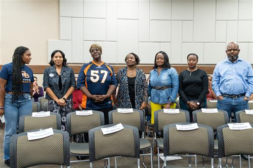 Ferndell Henry family stands to be recognized during Nov. 18, 2024 FBISD Board meeting